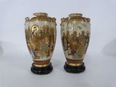 Pair of Japanese Satsuma ware vases of lobed form, decorated with Japanese figures and Mount Fuji in