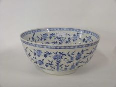 Large Japanese porcelain punch bowl decorated in blue and white with floral decoration within a