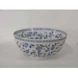 Large Japanese porcelain punch bowl decorated in blue and white with floral decoration within a
