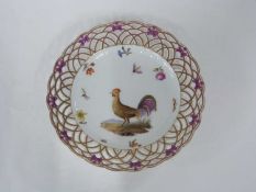 19th Century Berlin porcelain plate decorated with a chicken and bugs within a pierced border,