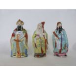 Group of three Chinese deity including Shou Lai with polychrome decoration, tallest 22cm high