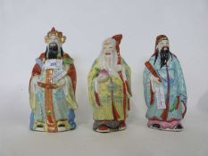 Group of three Chinese deity including Shou Lai with polychrome decoration, tallest 22cm high