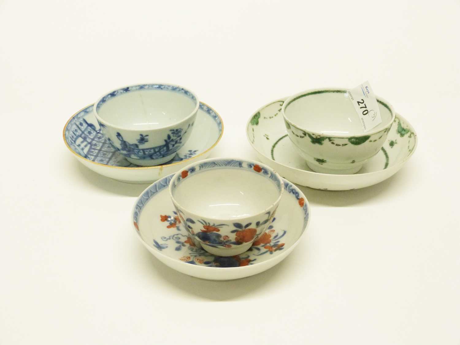 A group of three 18th Century Chinese export Chinese tea bowls and saucers including a Famille Verte