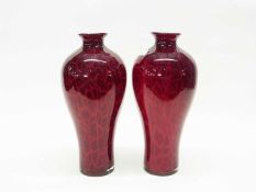 A large pair of Studio Glass vases, the baluster bodies with a rich red flambe colour with geometric