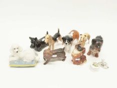 Tray containing quantity of dog figurines mainly by Beswick and a Royal Doulton figure of a