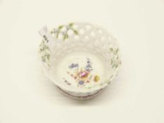 A Bow porcelain small basket, the interior painted with flowers in the manner of James Welsh (