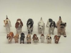 Group of dogs mainly modelled by Beswick, various breeds collies, terriers etc (14)