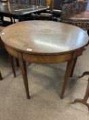 A Sheraton style circular centre table, the top with segmented satinwood veneered decoration, raised