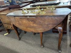 An early Georgian drop leaf table of oval form raised on cabriole legs, various repairs and areas of