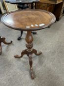 Reproduction mahogany circular top wine table on a turned column with tripod base, 77cm high