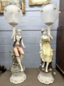 Pair of large continental porcelain figural table lamps formed as a young lady and gent, mounted