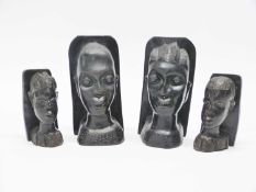 Group of four African ebonised carved heads as book ends