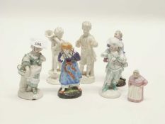 A group of continental porcelain figurines mainly of children together with a early 20th Century