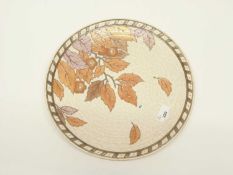 A Crown Ducal charger with a autumn leaves design by Charlotte Rhead, 32cm diameter, factory mark
