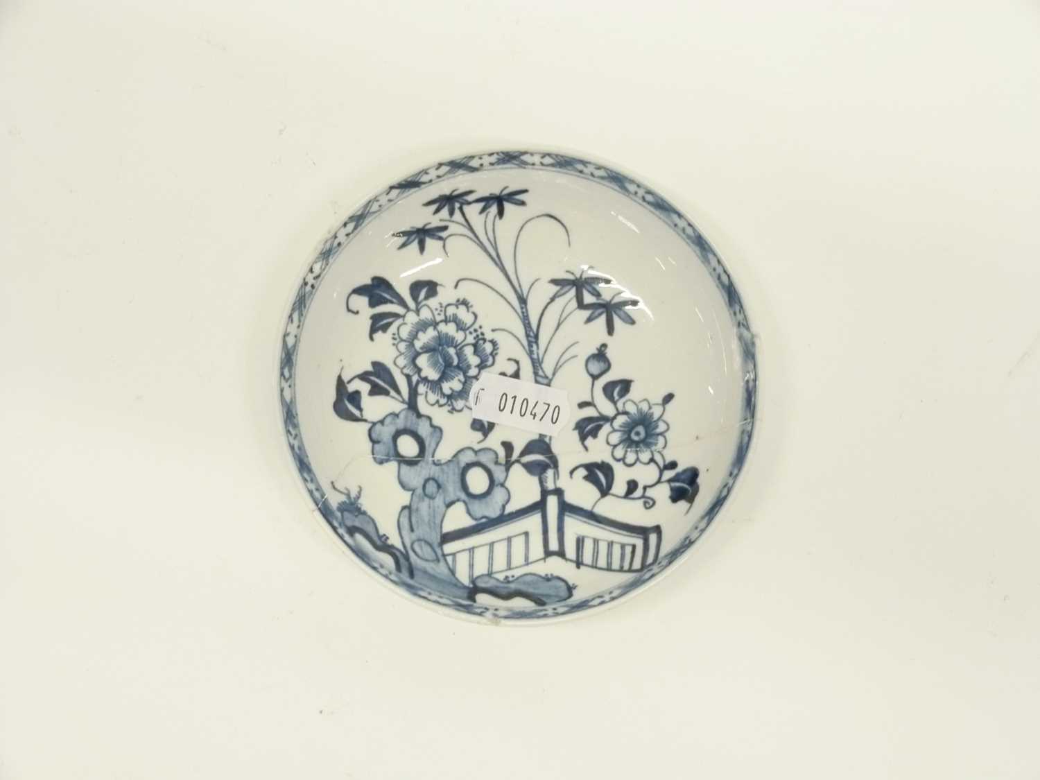 Three Lowestoft blue and white saucers, two with pagoda river scenes, one with a floral and fence - Image 3 of 4