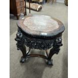 Chinese hardwood and marble inset plant stand set on four tapering legs with ball and claw feet,