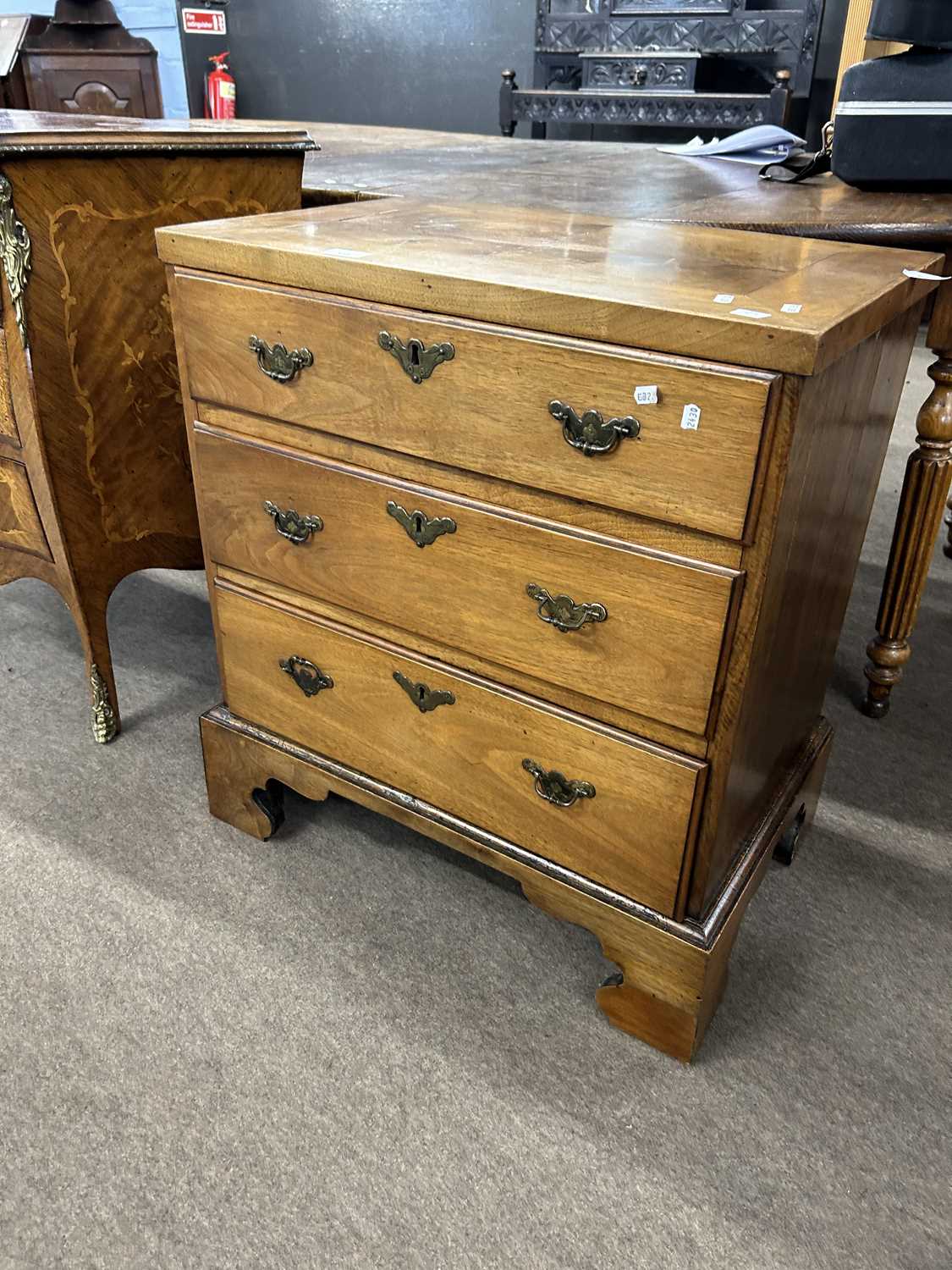 Small 19th Century walnut chest with three drawers over bracket feet, probably adapted from a larger