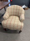 A Victorian small bow back armchair with later tartan upholstery raised on short cabriole legs