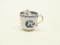 An early Lowestoft porcelain Hughes moulded coffee cup, numeral to foot rim (crack to body)