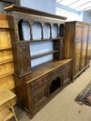 Large Victorian gothic revival heavily carved oak dresser with two shelf back, two small integral
