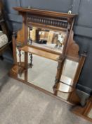 Small late Victorian American walnut over mantel mirror with six panels of bevelled glass, 90cm