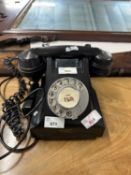 A mid 20th Century bakelite style telephone