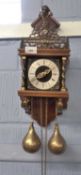 Continental pendulum clock with finial of Atlas above, Latin inscription with royal crest, 44cm