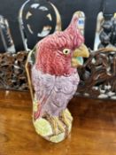 A vintage Majolica water jug in the form of a parrot