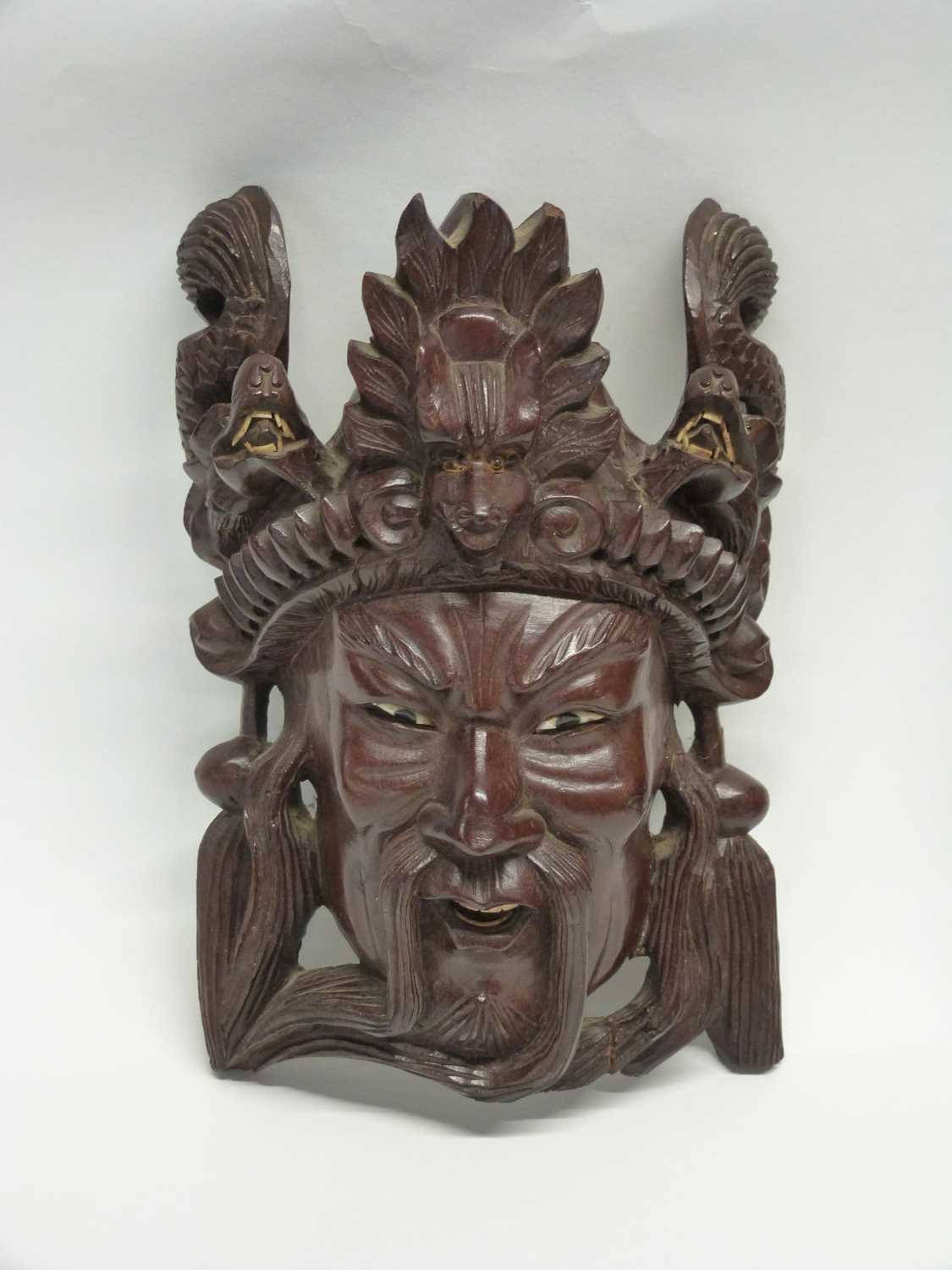 Group of four wooden carved masks, probably Balinese of various deitys - Image 2 of 5