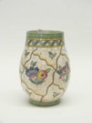 A Crown Ducal vase with floral design by Charlotte Rhead within banded geometric green borders, 24cm