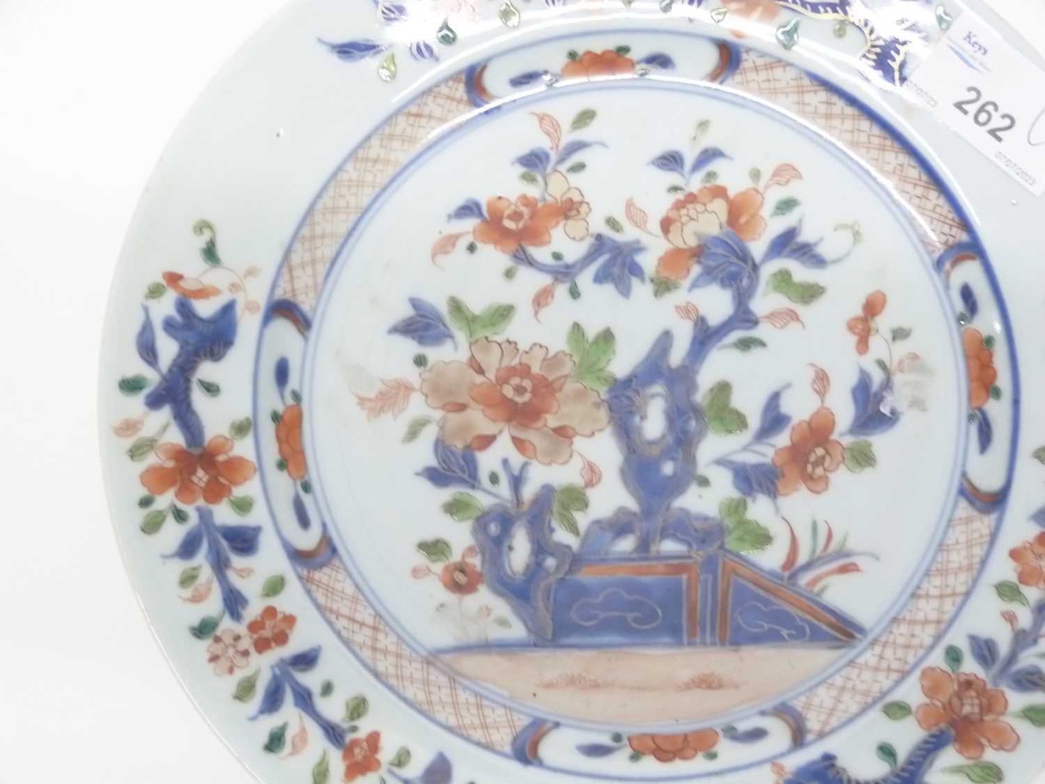 A 18th Century Chinese porcelain plate decorated in Imari style with blue and white trees and - Image 3 of 3