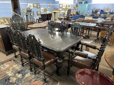 Victorian gothic revival dark oak extending dining table together with a set of eight accompanying
