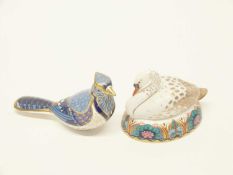 A Crown Derby paperweight modelled as a bird and a further example modelled as a swan