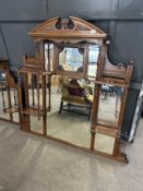 Late Victorian American walnut over mantel mirror with eight panels of bevelled glass surrounded