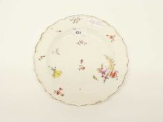 A Chelsea red anchor plate decorated with floral sprays in Meissen style (repairs to rim)