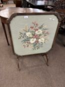 Early 20th Century combination fire screen and occasional table with wool work inset top, 85cm high