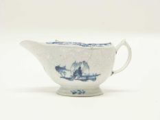 A large Lowestoft porcelain sauce boat circa 1765, the body with floral moulding and decorated