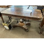 A Victorian rosewood veneered centre table with rectangular top over a bulbous column and four