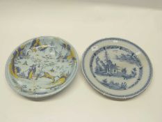 18th Century English Delft charger with blue and white design together with a further shallow