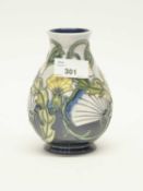 A Moorcroft vase with a tube lined floral design signed by J Moorcroft dated 3.5.97, 13cm high