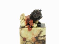 A soap stone carving of Chinese dragons mounted on a rectangular plinth, 11cm high
