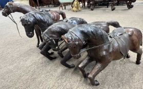 A set of four leather horses attributed to Dimitri Omersa designed for Liberty