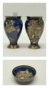 A pair of Carlton ware vases and a bowl, circa 1930's. The vases decorated in Chinese porcelain