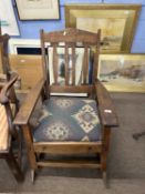 Arts & Crafts oak rocking chair with a slightly Cotswold school influenced style, 95cm high