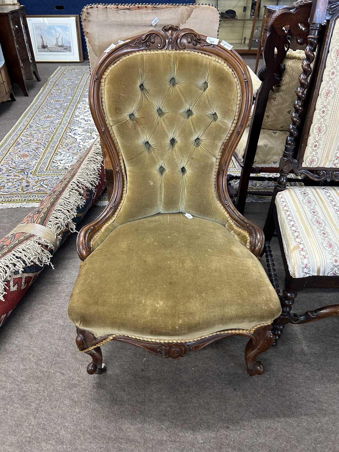 A Victorian button upholstered nursing chair with carved showwood frame, 90cm high
