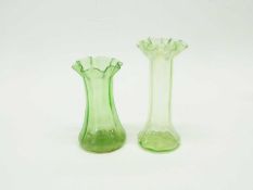 Group of green glass wares comprising a vase, further spill vase, two vaseline green vases and small