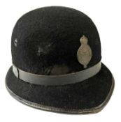 Royal Ulster Constabulary one piece bowler-shaped policeman's helmet with black leather band and