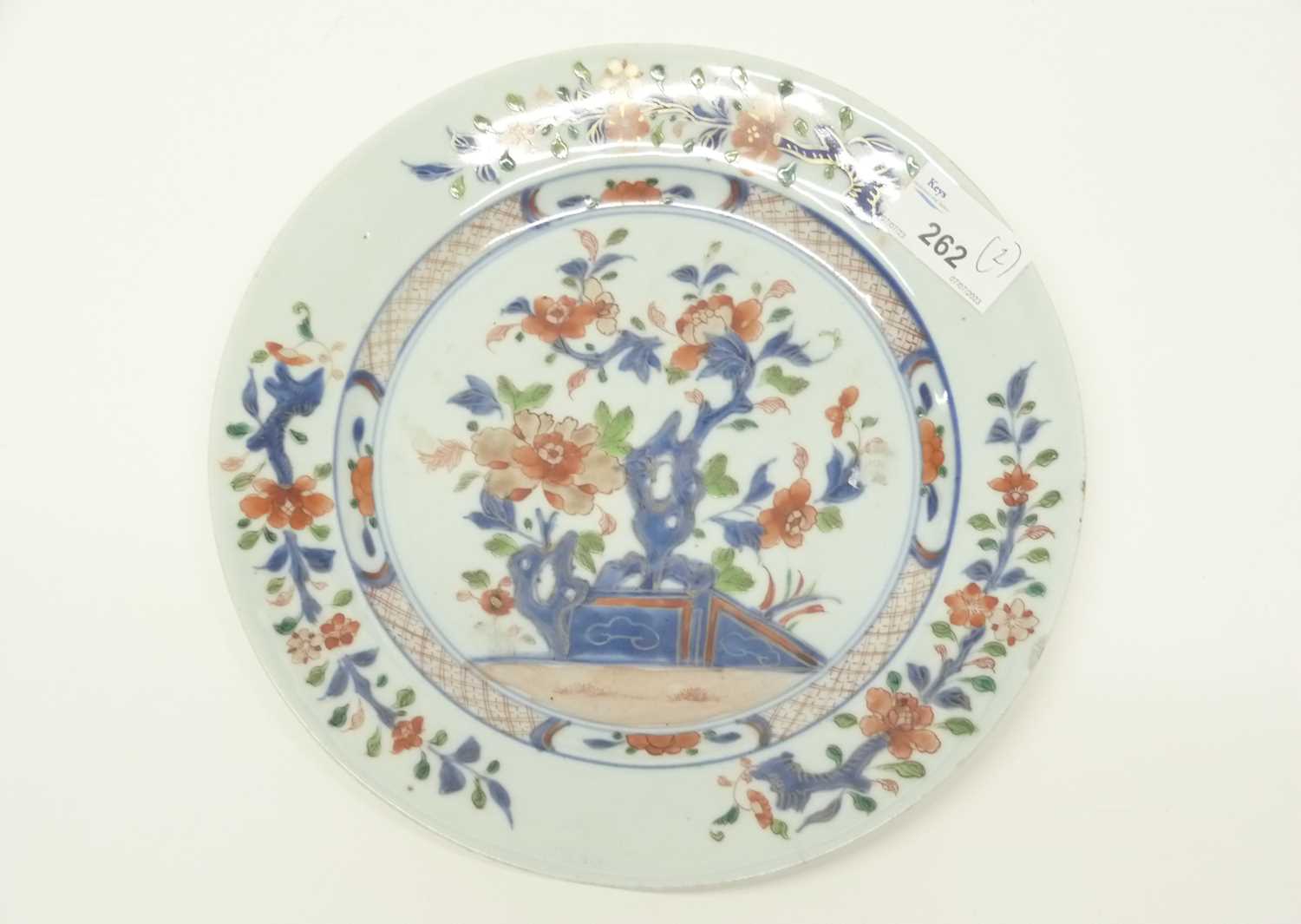 A 18th Century Chinese porcelain plate decorated in Imari style with blue and white trees and