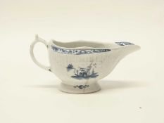 Lowestoft porcelain sauce boat, the reeded body with Chinoiserie scenes