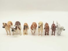 A group of porcelain dog figurines including a Beswick Bulldog entitled "Basford British Mascot",